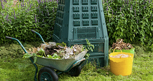 composter and wheelbarrow full of garden waste